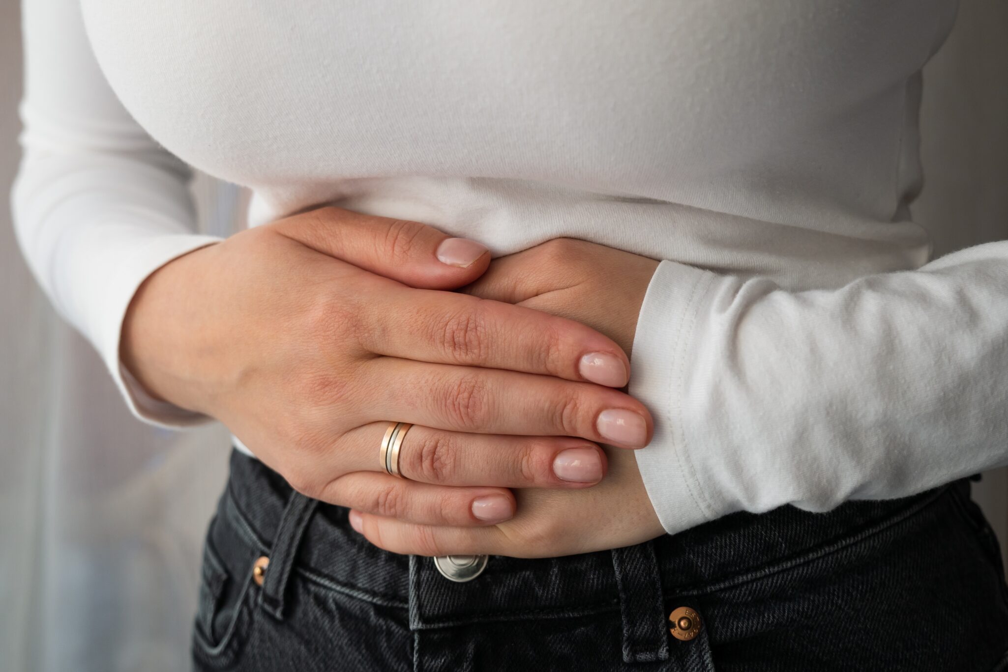 Woman,With,Stomach,Pain,,Clutching,Upper,Abdomen,,Suffering,From,Bloating